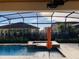 A luxurious pool with an attached jacuzzi provides the perfect outdoor relaxation and entertainment space at 3034 Boating Blvd, Kissimmee, FL 34746