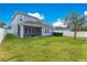 Spacious backyard with a large grassy area at 3074 White Horse Ct, Kissimmee, FL 34746