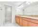 Bathroom with double vanity and tub/shower combo at 3074 White Horse Ct, Kissimmee, FL 34746
