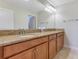 Bathroom with double vanity and granite countertop at 3074 White Horse Ct, Kissimmee, FL 34746
