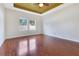 Spacious bedroom with hardwood floors and large windows at 3074 White Horse Ct, Kissimmee, FL 34746