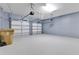 Two-car garage with light grey walls and epoxy flooring at 3074 White Horse Ct, Kissimmee, FL 34746