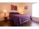 Guest bedroom with double bed, hardwood floors, and wall art at 4626 Cumbrian Lakes Dr, Kissimmee, FL 34746