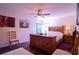Cozy bedroom with wooden furniture and large artwork at 4626 Cumbrian Lakes Dr, Kissimmee, FL 34746