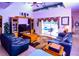 Spacious living room with leather sofas and a large TV at 4626 Cumbrian Lakes Dr, Kissimmee, FL 34746