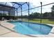 Relaxing screened pool and spa overlooking a lake at 4626 Cumbrian Lakes Dr, Kissimmee, FL 34746