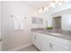 Elegant bathroom with a double vanity and modern light fixtures at 4816 Memories Ln, Kissimmee, FL 34746