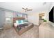 Main bedroom with a king-size bed, carpet flooring, and large TV at 4816 Memories Ln, Kissimmee, FL 34746