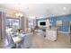 Modern kitchen with island, stainless steel appliances, and open layout at 4816 Memories Ln, Kissimmee, FL 34746