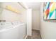Convenient laundry room with washer, dryer, and ample shelf space at 4816 Memories Ln, Kissimmee, FL 34746