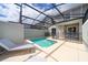 Private screened-in pool with lounge chair and patio area at 4816 Memories Ln, Kissimmee, FL 34746