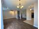 Open living and dining area with hardwood floors and a view of the kitchen at 6660 S Goldenrod Rd # 126B, Orlando, FL 32822
