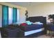 Spacious main bedroom with a large bed and plenty of light at 7438 Wayland Blvd, Orlando, FL 32807