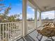 Relaxing balcony with rocking chair and neighborhood view at 7509 Mourning Dove Cir # 304, Reunion, FL 34747