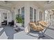 Private balcony with rocking chairs and space for gardening at 7509 Mourning Dove Cir # 304, Reunion, FL 34747