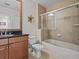Clean bathroom with a tub, shower, and granite vanity at 7509 Mourning Dove Cir # 304, Reunion, FL 34747