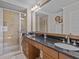 Elegant bathroom with double vanity and walk-in shower at 7509 Mourning Dove Cir # 304, Reunion, FL 34747