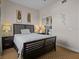 Bedroom with king-size bed and large window with curtains at 7509 Mourning Dove Cir # 304, Reunion, FL 34747