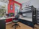 bedroom with bunk beds, workspace, and Mickey Mouse decor at 7509 Mourning Dove Cir # 304, Reunion, FL 34747
