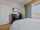 Bedroom with queen bed and built-in dresser at 7509 Mourning Dove Cir # 304, Reunion, FL 34747