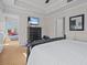 Spacious bedroom with large windows and en-suite bathroom at 7509 Mourning Dove Cir # 304, Reunion, FL 34747