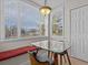 Breakfast nook with glass table and window seat at 7509 Mourning Dove Cir # 304, Reunion, FL 34747