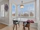 Bright breakfast nook with glass table and built-in seating at 7509 Mourning Dove Cir # 304, Reunion, FL 34747