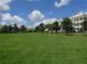 Green lawn area with building in background at 7509 Mourning Dove Cir # 304, Reunion, FL 34747