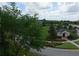 Landscaped green space with gazebo and paved pathway at 7509 Mourning Dove Cir # 304, Reunion, FL 34747