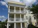 Three-story building with multiple balconies and a classic design at 7509 Mourning Dove Cir # 304, Reunion, FL 34747