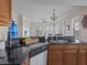 Modern kitchen features granite countertops and stainless steel appliances at 7509 Mourning Dove Cir # 304, Reunion, FL 34747