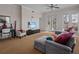 Spacious living room with sectional sofa and access to balcony at 7509 Mourning Dove Cir # 304, Reunion, FL 34747