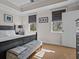 Main bedroom with king bed, bench, and neutral decor at 7509 Mourning Dove Cir # 304, Reunion, FL 34747