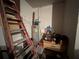 Unfinished basement area with water heater and storage at 869 Colville Dr, Kissimmee, FL 34759