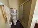 Bathroom with shower/tub combo, toilet and cabinet at 869 Colville Dr, Kissimmee, FL 34759