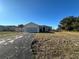 One-story house with a garage and yard at 869 Colville Dr, Kissimmee, FL 34759