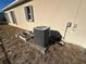 AC unit and side of house shown at 869 Colville Dr, Kissimmee, FL 34759