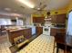 Cozy kitchen features wood cabinets, white appliances, and a breakfast nook at 869 Colville Dr, Kissimmee, FL 34759