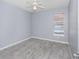 Bedroom with gray walls, tile floors, and a window with blinds at 8848 Villa View # 106, Orlando, FL 32821
