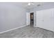 Bedroom with gray walls, tile floors, and double door closet at 8848 Villa View # 106, Orlando, FL 32821