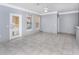 Living room with tile floors, gray walls, and sliding glass doors at 8848 Villa View # 106, Orlando, FL 32821