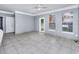 Spacious living room with tile floors and neutral gray walls at 8848 Villa View # 106, Orlando, FL 32821