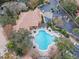 Community pool with surrounding patio and landscaping at 8848 Villa View # 106, Orlando, FL 32821
