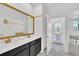 Elegant bathroom with double vanity, soaking tub, and private access at 9194 Sommerset Hills Dr, Davenport, FL 33896