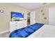 Bedroom with a king-size bed and a large TV at 9194 Sommerset Hills Dr, Davenport, FL 33896