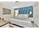 Serene bedroom with a king-size bed and accent wall at 9194 Sommerset Hills Dr, Davenport, FL 33896