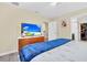 Bedroom with king-size bed, TV, and dresser at 9194 Sommerset Hills Dr, Davenport, FL 33896