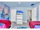 Two twin beds in a Frozen-themed bedroom with mural and TV at 9194 Sommerset Hills Dr, Davenport, FL 33896