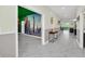 Bright entryway with dinosaur mural and tile flooring at 9194 Sommerset Hills Dr, Davenport, FL 33896