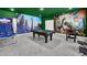 Fun game room with pool table, foosball, and basketball game at 9194 Sommerset Hills Dr, Davenport, FL 33896